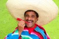 9416784-Mexican-man-poncho-sombrero-eating-red-chili-hot-pepper-Mexico-Stock-Photo.jpg